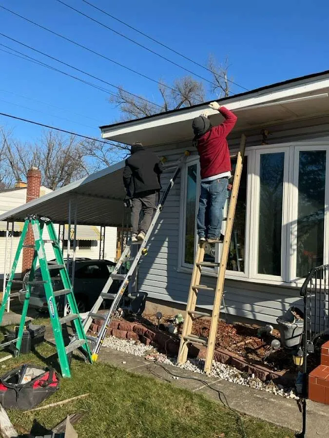 Restoration crew performing exterior repair in Harrison